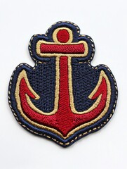 A red and gold embroidered anchor patch on a blue background.