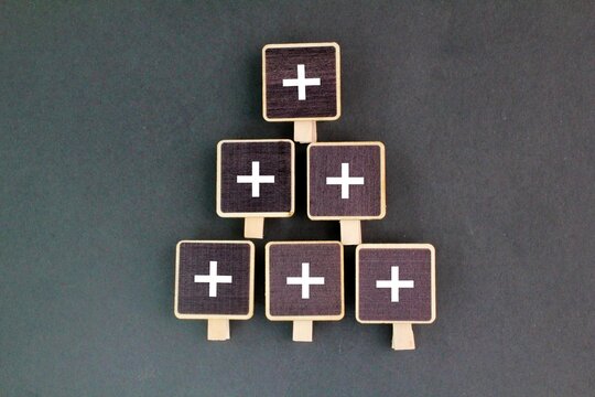 stick with plus icon stacked up, addition or add more. Value added concept. An improvement or addition to something that makes it more valuable. Positive thinking or personal growth.