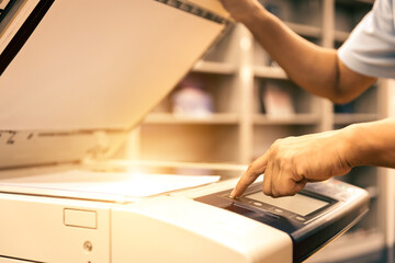 Businessman use photocopy or copier or photocopier in office workplace is equipment for copy...