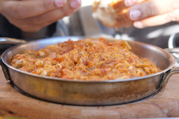 Turkish Menemen omelet in a frying pan. .