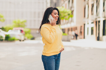Photo of nice lovely girl wear yellow stylish clothes speak phone city walk downtown sunny day outdoors