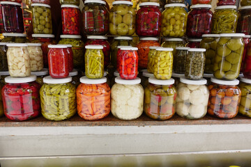 Canned fruits and vegetables in glass jars