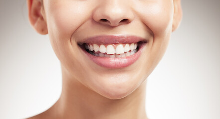 Woman, mouth and smile in studio for dental care, hygiene and results of teeth whitening. Person,...