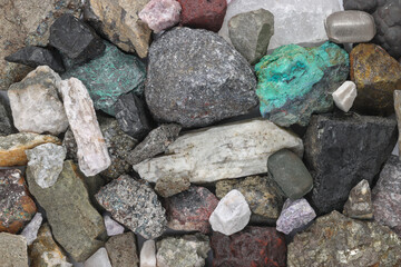 Mixture, variety of critical minerals, raw materials. Required for modern technology, such as solar panels, semiconductors, wind turbines, batteries, transportation. Mine, mining, background concept.