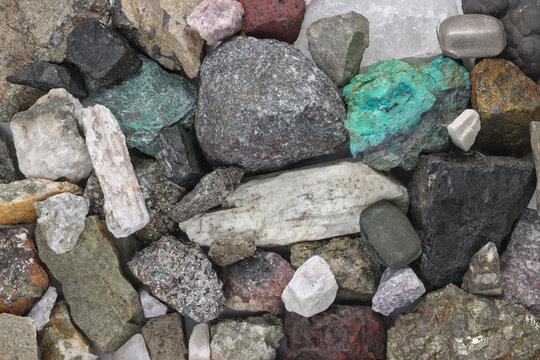 Mixture, variety of critical minerals, raw materials. Required for modern technology, such as solar panels, semiconductors, wind turbines, batteries, transportation. Mine, mining, background concept.