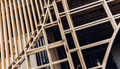 A structure featuring wooden slats on construction site contributing to its architectural style