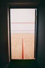 Squash, background and court for workout, game and exercise in sport competition as open entrance. Indoor club, texture and activity in gym for wellness, match or training in athletics, hobby and fun
