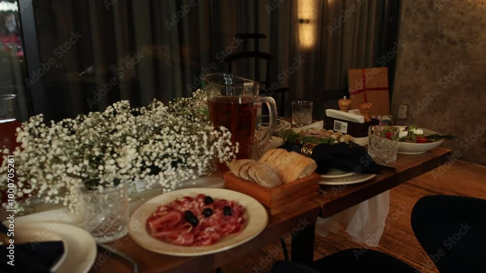 Sticker festive table with appetizers and salads on the table in the restaurant