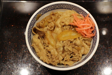 Japanese cuisine: gyudon (beef bowl) with beni shoga (pickled red ginger) in Tokyo, Japan