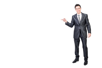 Smiling man pointing aside in studio. White background.