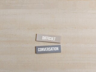 Obraz premium colored paper with the words Difficult Conversation. different of thought. business finance 