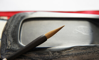 In the traditional manners of Japan, syodou tools called brushes and inkstones