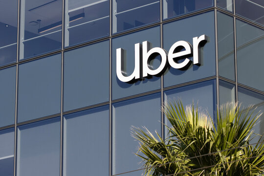 San Francisco, CA, USA - Feb 22, 2024: Uber sign is seen at its new headquarters in San Francisco's Mission Bay, California. Uber develops, markets, and operates a ride-sharing mobile application.