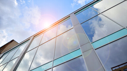 Exterior of a high modern multi-story apartment building - facade, windows and balconies.