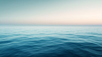 Obraz premium Calm ocean waves at sunrise, serene atmosphere