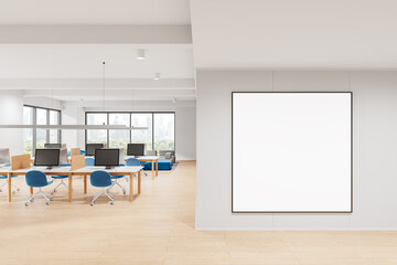 Cozy coworking interior with pc computers and sofa near window. Mockup frame