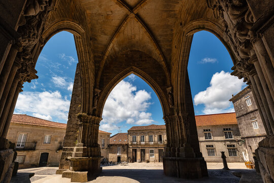 Main entrance to Tui Cathedral with very old high stone arches, Pontevedra, Galicia.