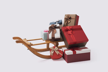 Christmas gifts and wooden sleigh