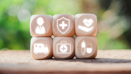 Wooden blocks with icons symbolizing different aspects of Medicare, such as healthcare, safety, medical services, and emergency response.