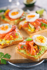 Avocado, smoked salmon, and egg on toast. Perfect for a healthy breakfast or light gourmet meal