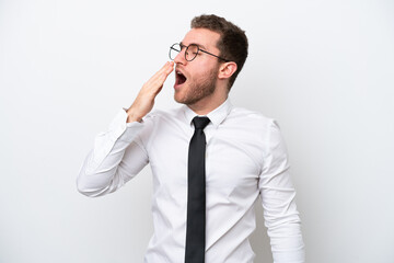 Young business caucasian man isolated on white background yawning and covering wide open mouth with hand
