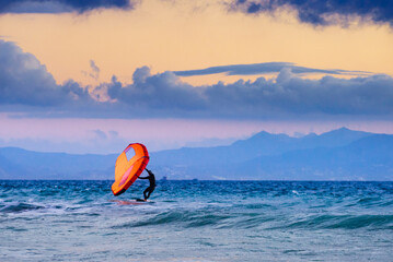 Surfer in sea water. Sport activity.