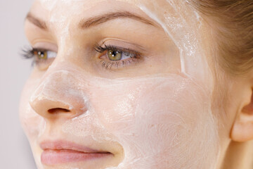 Fototapeta premium Girl with cream moisture cosmetic on face