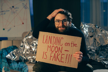 A conspiracy theorist with a message: The moon landing is fake.