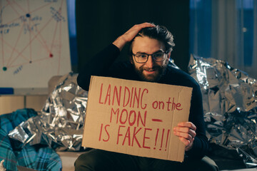 A conspiracy theorist with a message: The moon landing is fake.