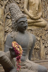 Temple sculpture with garland Sri Lanka