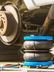 Car in service. Installing air ride suspension.