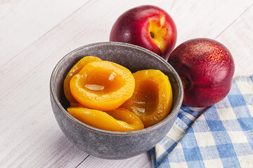 Canned peaches with sweet syrope