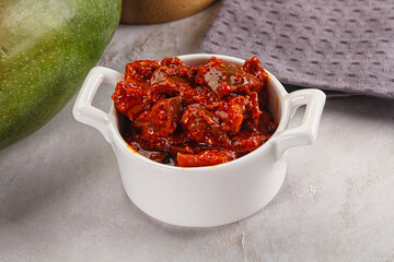 Spicy pickled raw green mango