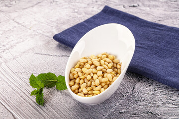 Peeled cedar nut in the bowl