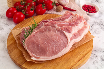 Raw potk loin steak with bone