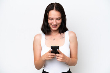 Young caucasian woman isolated on white background sending a message or email with the mobile