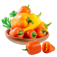 A wooden bowl filled with colorful bell peppers, isolated on white background. One of the red bell peppers is cut in half, revealing the inside seeds and ribs.