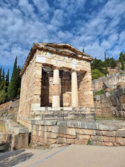 Fototapeta premium Ruins of an ancient greek temple at Delphi, Greece., at the Mount Parnassus. Delphi is famous by the oracle at the sanctuary dedicated to Apollo.