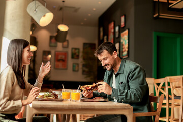 Enjoying a delightful brunch together at a cozy cafe on a sunny afternoon in the heart of the city