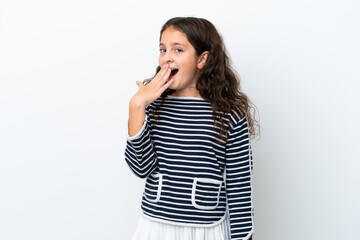 Fototapeta premium Little caucasian girl isolated on white background yawning and covering wide open mouth with hand