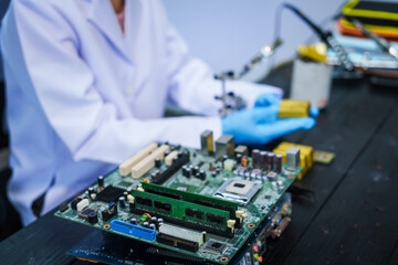 Factory worker overseas molten metal pouring into mold, surrounded by glowing heat in a steel foundry. Microchips and computer hardware components semiconductor and gold metal manufacturing.