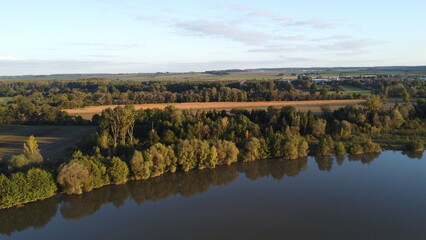 Naklejka premium morning view from above on the lake surface, Dolni Benesov, Opava, Silesia, Czech, Landscape, Drone View