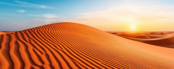 Naklejka premium Stunning view of vast desert dunes under a vibrant sky at sunset, showcasing the beauty of nature with smooth sand surfaces and the warm glow of the setting sun.