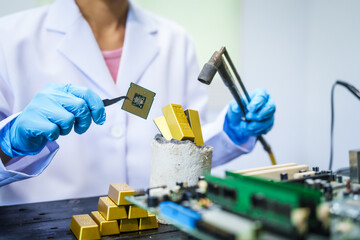 Factory worker overseas molten metal pouring into mold, surrounded by glowing heat in a steel foundry. Microchips and computer hardware components semiconductor and gold metal manufacturing.