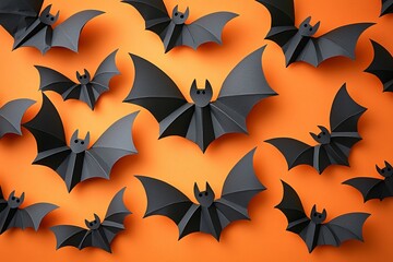 Naklejka premium Vibrant black paper bats on an orange background ideal for Day of the Dead (Dia De Los Muertos) decorations, themed parties, or festive messaging.