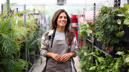 Portrait of a female gardener enjoying among her plants