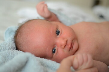 Newborn baby's holding mother's finger. Mom and baby