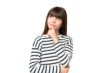Little caucasian girl over isolated background and looking up