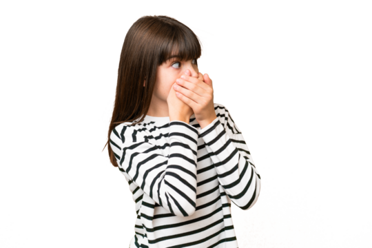 Little caucasian girl over isolated background covering mouth and looking to the side