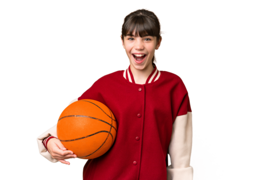 Little caucasian girl playing basketball over isolated background with surprise facial expression